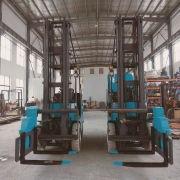 5 Ton Electric Forklift with Three-Way Fork Attachment