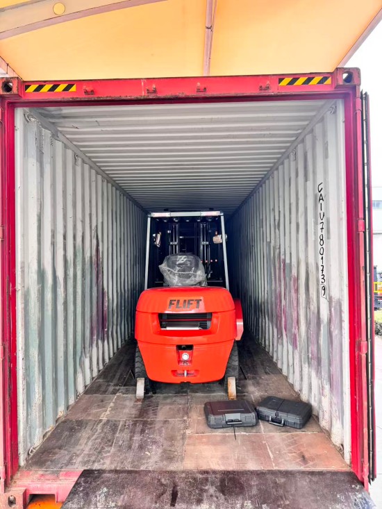 forklift with paper roll clamp attachment